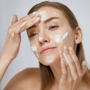 woman-applying-cleanser-hydrating-skin